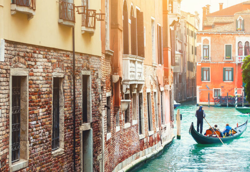 Beautiful canal with old architecture in Venice, Italy.