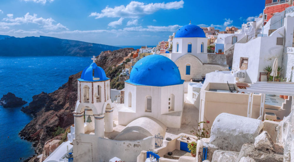 Oia village in Santorini island with famous churches, Greece